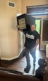 Shouldering a nightstand getting up stairs quickly.