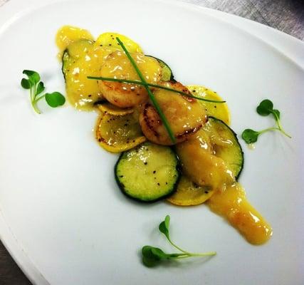 Seared scallops, sautéed zucchini and summer squash with buerre blanc.