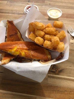 Inside Out Grilled Cheese with Regular Tots and a Side of Bacon Queso Cheese