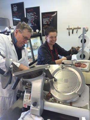 Frody and his assistant slicing and packaging