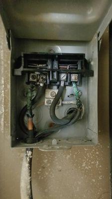 Pre repair: Old HVAC disconnect, falling apart, wires burned out. This is what was fixed.