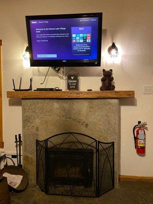 Our cute cabin's fireplace and roku TV(s) to watch our favorite shows