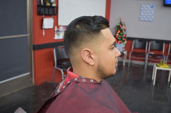 Low fade shaved with a line up and light trim on top