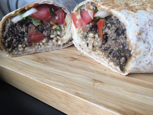 Beef and lentil burrito, filled with oat groats, pico de gallo, cheddar and lime crema