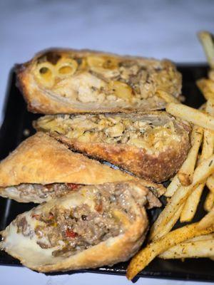 Steak and cheese and the Mac n cheese jerk chicken egg rolls was so amazing 10/10