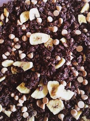 Our granola is made on premises. Organic rolled oats, organic unsweetened banana chips, cocoa and peanut butter chips! Shown: Chunky Monkey