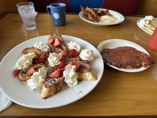 Nutella Cream Cheese Stuffed French Toast with Corned Beef Hash on the side.