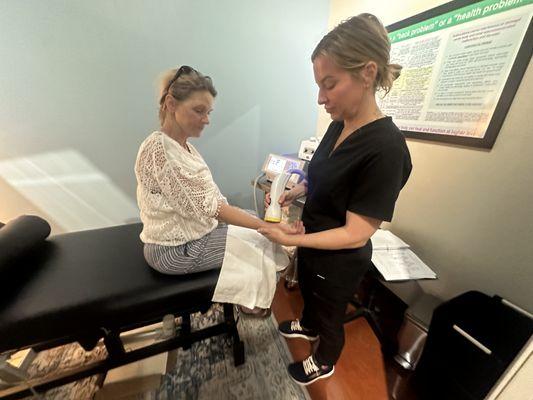 Cheryl getting relief from chronic wrist pain from years of working a physical job