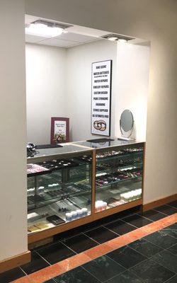 Counter located next to Women's Shoes and west exit to street