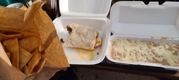 Flour chips, a burrito with only meat, and beans with cheese on top. $21