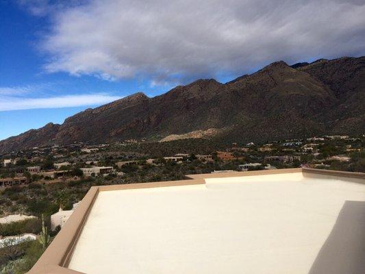 Reflective roof coating in Tucson, AZ 85718 Boosting energy efficiency and protecting this flat roof year-round.