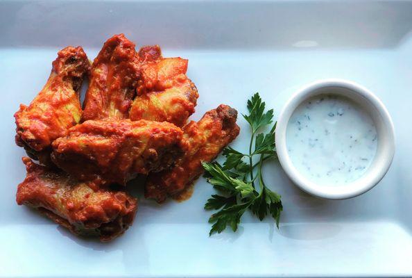 Join us for happy hour! Featured are our Tandoori spiced chicken wings.