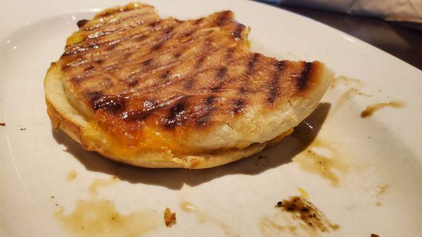 My half eaten breakfast sandwich with bacon, run through a panini press. For $11.