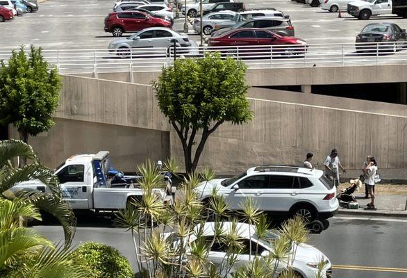 Towing woman who ran up with her child in tow, crying begging not to tow their car!