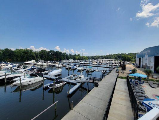 A view from the deck of our yacht club clubhouse overlooking the docks. Our indoor storage "boatel" can be seen to the right of the photo