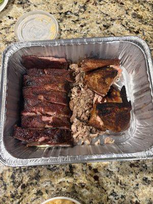 1/2 pound of pulled pork, 8 ribs, and 1/2 a chicken