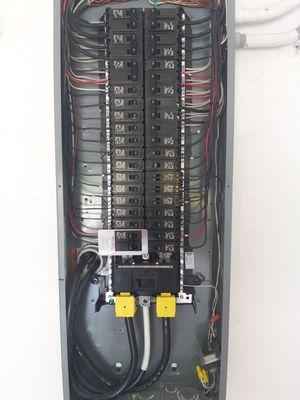 Interior view - New electrical service panel w/ generator interlock (lower left)