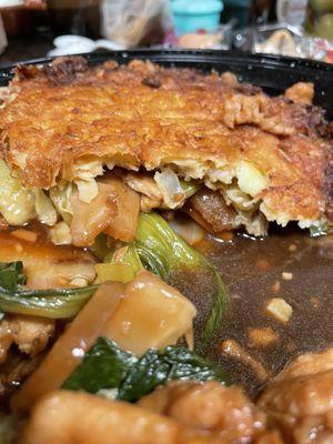 Egg Foo Young piled into one container now.