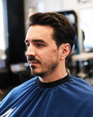 Regular clean look with long hair on top.