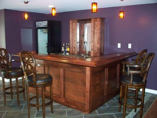 basement remodel with custom tile floor and custom bar built on site