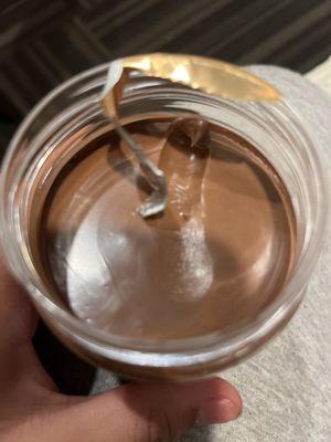 someone opening this Nutella jar and putting there finger in it
