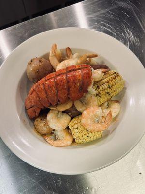 Shrimp and Lobster Pot: Lobster tail, 1/2 lbs of shrimp, andouille sausage, red potatoes, corn