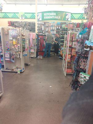 Employees, one stocking (gossiping), the other just gossiping back