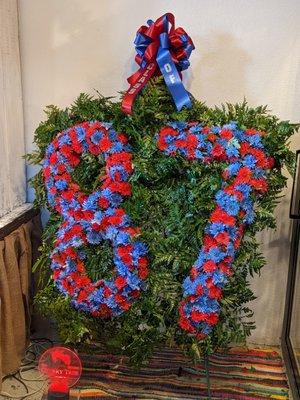 This impressive standing spray is one of a kind! We love to create unique designs!