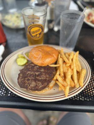 Hamburger and fries with onion with an IPA
