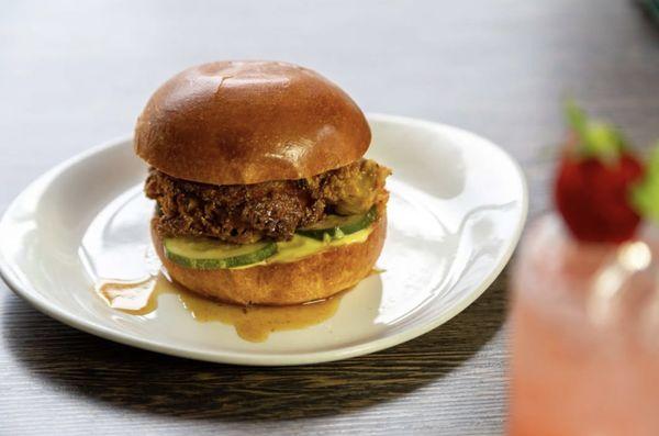 "The Misses" Chicken Sandwich. Buttermilk-brined, perfectly crispy, and layered with house pickles, aioli, and a drizzle of Old Bay Honey.