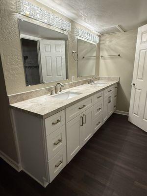 New floors, vanity, sinks, counter tops, lights.