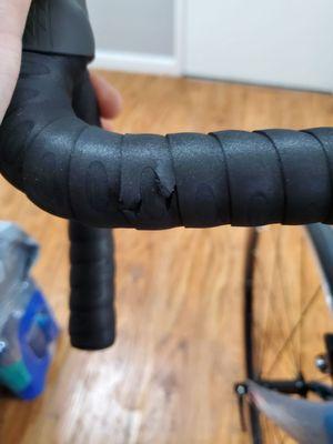 Damage to handlebar tape from poor packaging.
