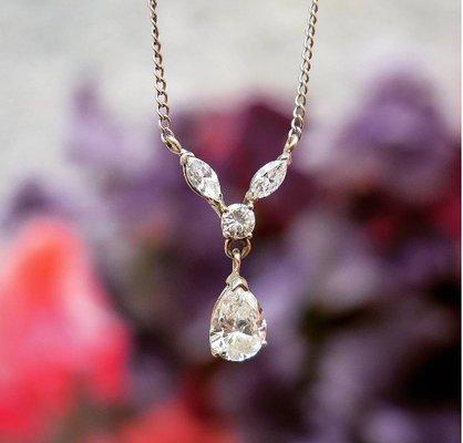 Pear shaped drop diamond with one round and two marquise shaped - estate jewelry