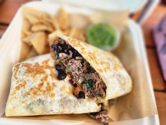 Burrito comes with chips and a delicious green salsa