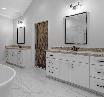 White shaker cabinets paired with granite countertops