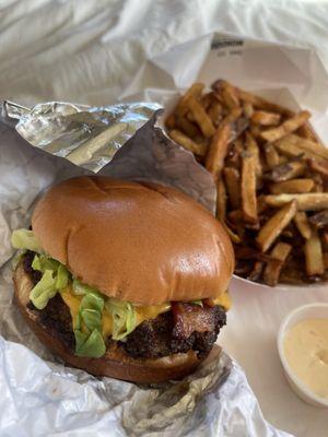 Cheeseburger, add bacon. Order of fries (comes with a sauce). If you think you'll eat all the fries, buy an extra sauce!