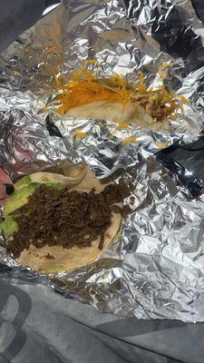 Bacon, egg, and cheese taco on flour Beef fajita taco with avocado on flour