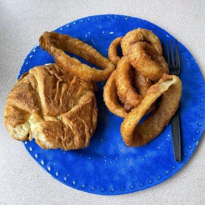 Egg salad on croissant with onion rings