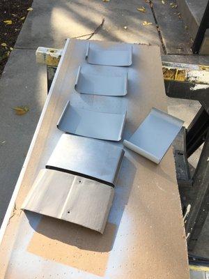 The original and the replacement pieces by Carver.