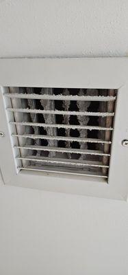 Look at the dust in the vents in the room.