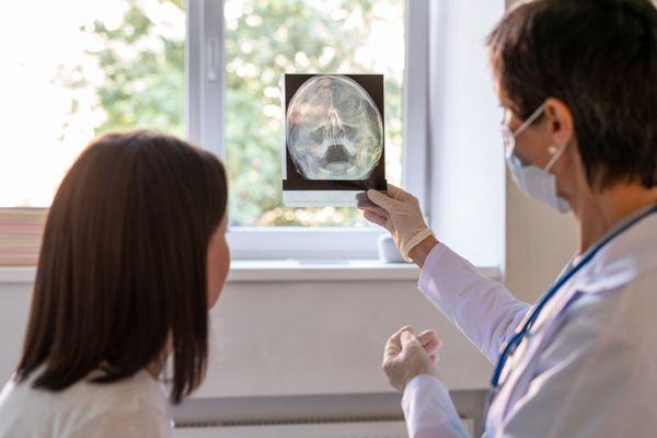 Doctor looking at image with patient.