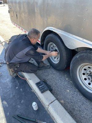 Frankie replacing trailer tire