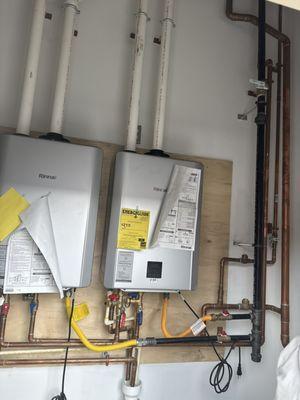 Installing a high-efficiency tankless water heater. Endless hot water, lower energy bills!