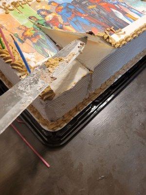 Cake with paper on top from GRACIOUS BAKERY.