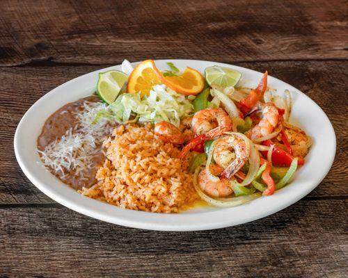 Shrimp Fajitas Plate - grilled, seasoned shrimp sautéed with onions & bell peppers. served with warm corn or flour tortillas.