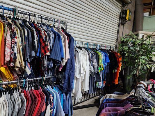 Lots of guy clothes and jewelry