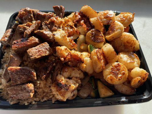New York Steak , Lobster, scallops and fried rice with Vegetables