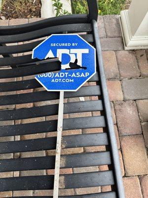 damaged ADT security sign