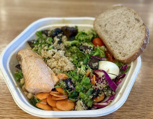 Custom Salmon bowl: Arugula, Quinoa, Cabbage, Chickpeas, Egg, Raw Carrots, Spicy Broccoli, Tomatoes, and Portobello Mix