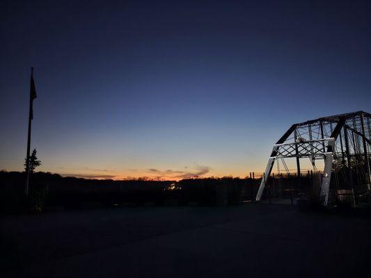 The view from the east side of the Freedom Bridge, as the sun sets behind the city of Delphi.